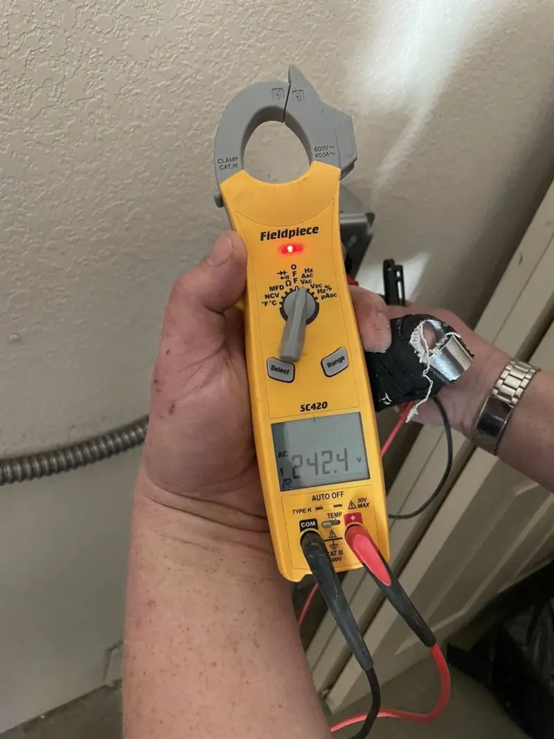 Voltage testing with clamp meter during Electrical Installation Services in Marshall